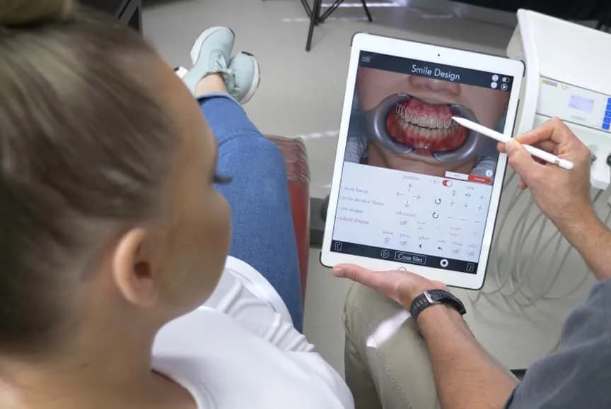Dentist explaining treatment plan with dental model