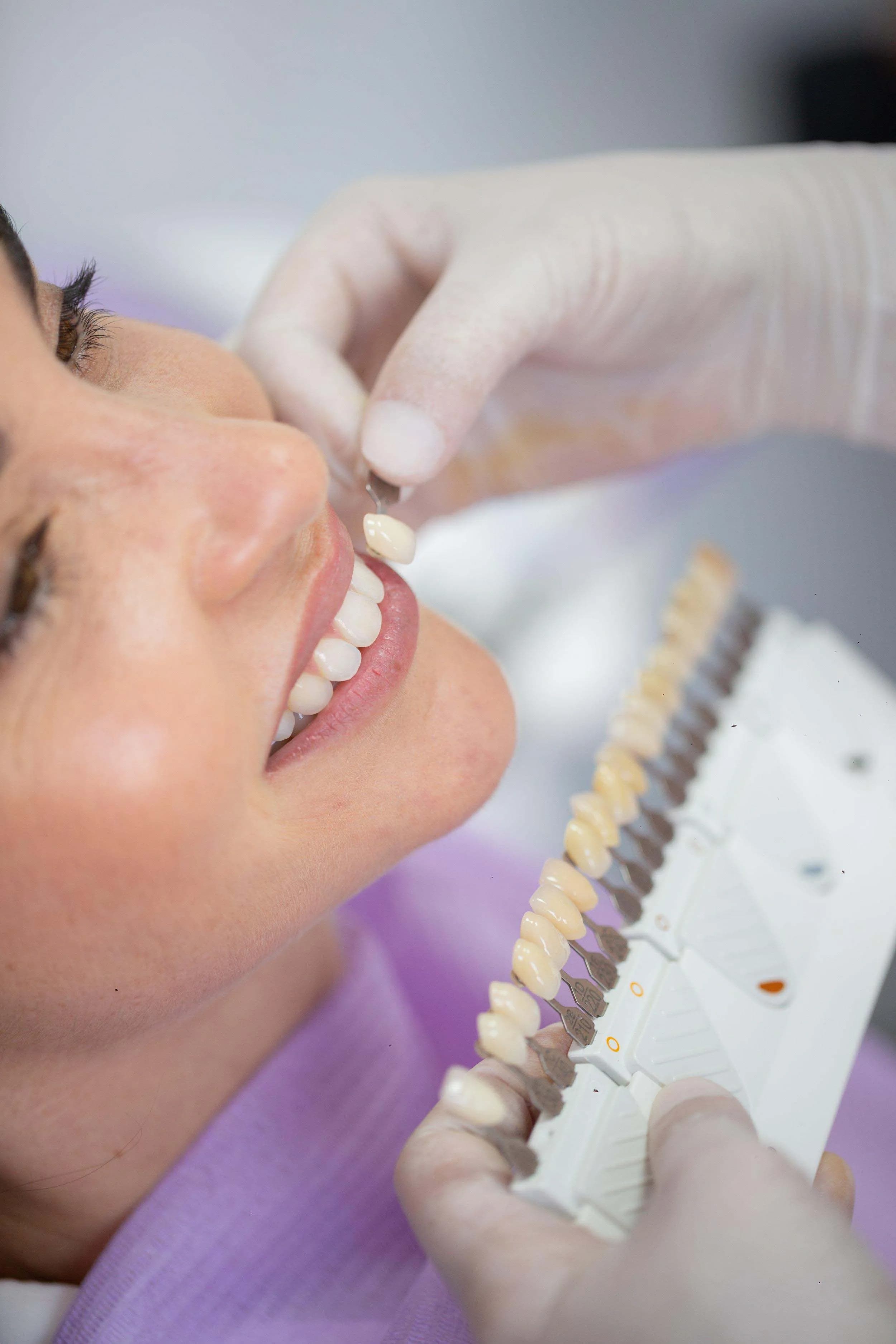 Dentist performing precise cosmetic dental treatment