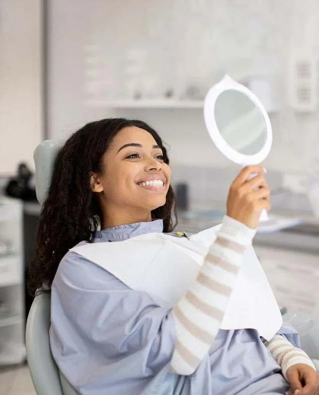 Young woman laughing with a beautifully straight smile