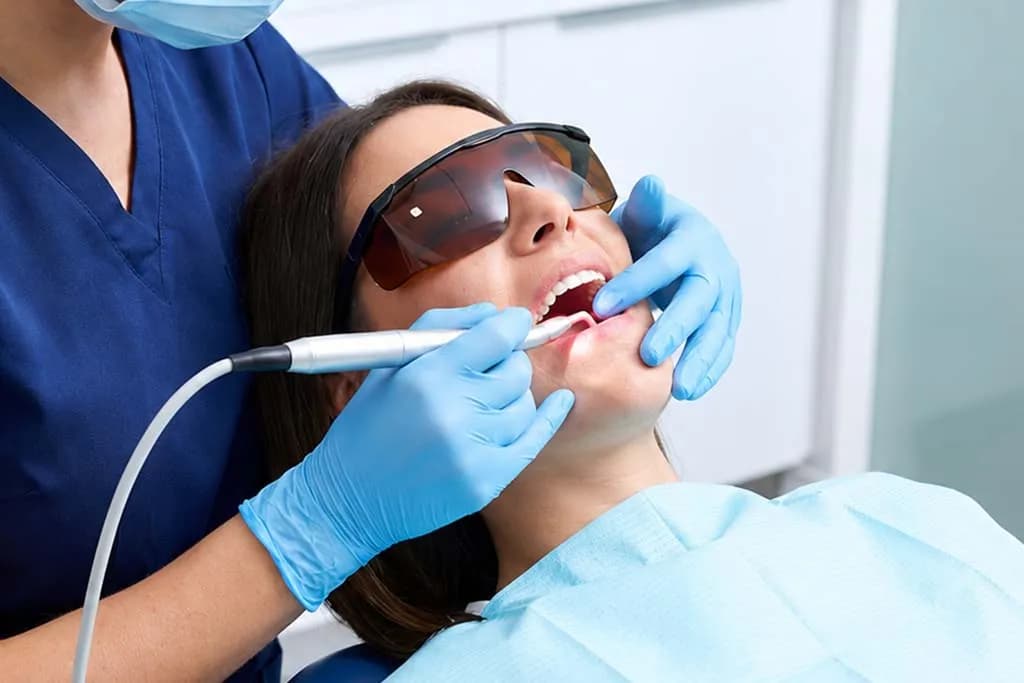 Dentist evaluating gum health during periodontal exam