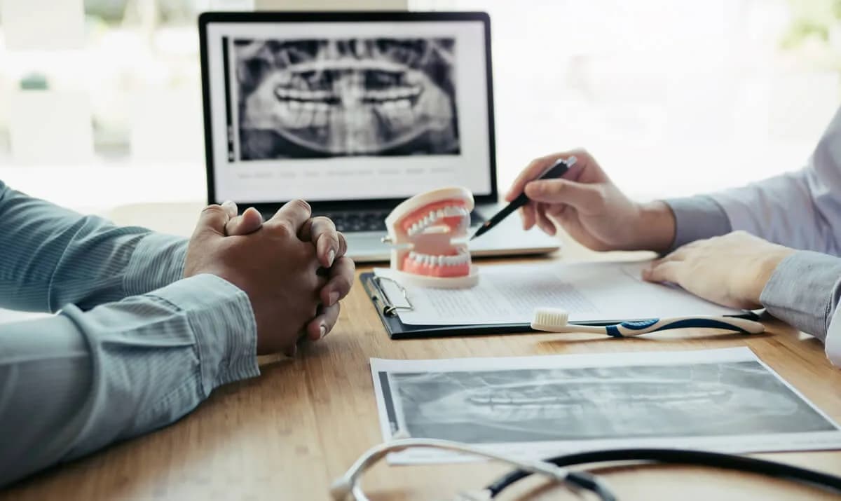Doctor reviewing periodontal x-ray