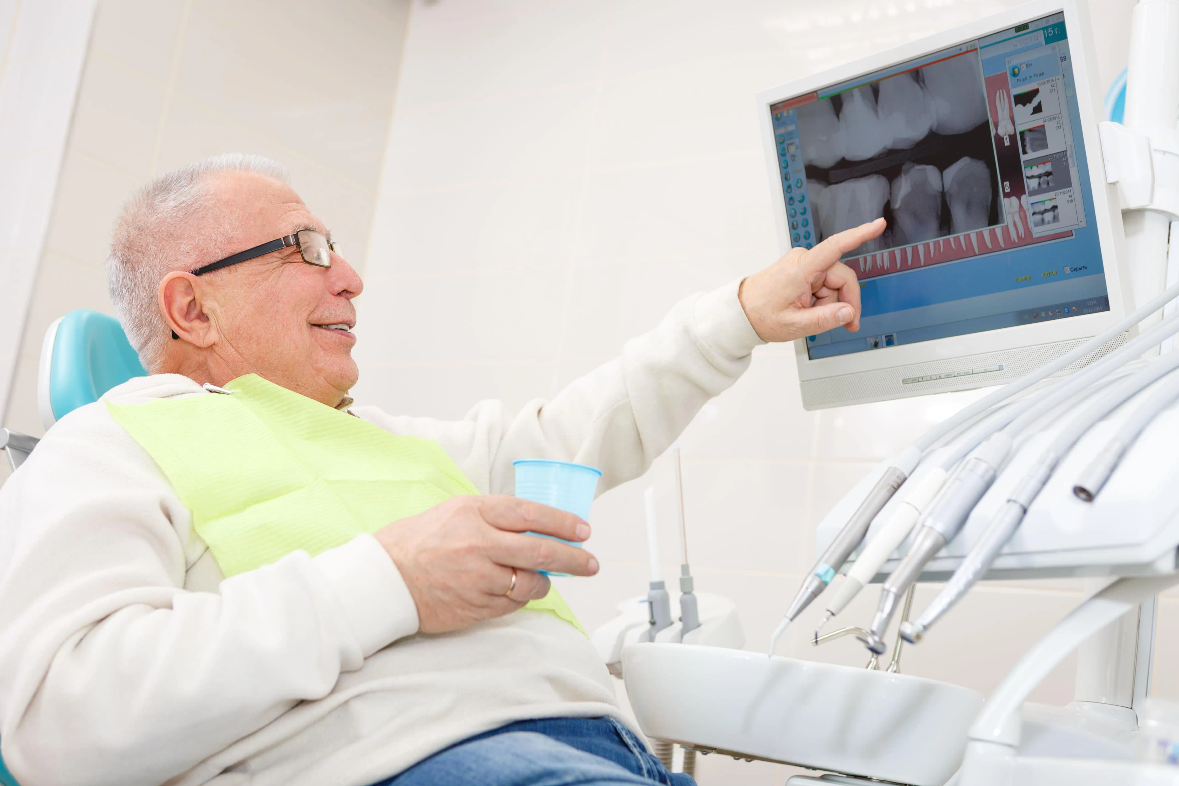 Dentist discussing restorative treatment options with patient