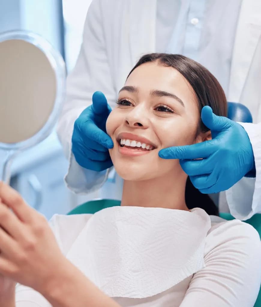 Dentist examining patient during a follow-up visit