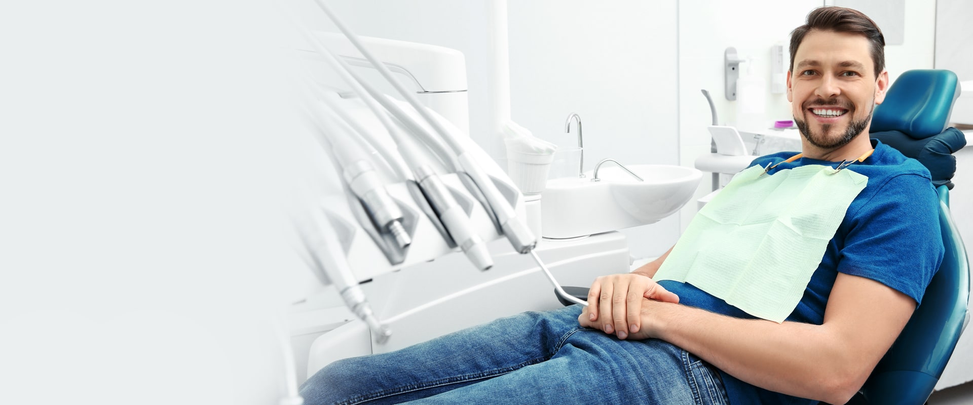 A happy picture of a man at dental office